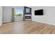Spacious living room features a fireplace, ample natural light, and hardwood floors at 11343 E 163Rd Ct, Brighton, CO 80602