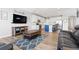 Open-concept space seamlessly blends kitchen, living, and dining areas for modern living at 11343 E 163Rd Ct, Brighton, CO 80602