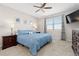 Inviting main bedroom boasts a plush bed, side tables, and large windows with views at 11343 E 163Rd Ct, Brighton, CO 80602