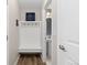 Cozy mudroom features a built-in bench with coat hooks and a convenient powder room at 11343 E 163Rd Ct, Brighton, CO 80602