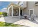 Covered outdoor patio area, seating, and fire pit, perfect for backyard entertaining at 11343 E 163Rd Ct, Brighton, CO 80602