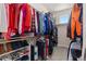 Walk-in closet with built-in shelving and ample space for storage of clothing and shoes at 11343 E 163Rd Ct, Brighton, CO 80602