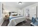 Spacious bedroom with neutral decor and hardwood floors at 2585 Ames St, Edgewater, CO 80214