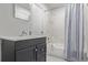 A clean bathroom includes a dark vanity with a sink and a shower/bathtub combo at 6455 E Bates Ave # 4-105, Denver, CO 80222