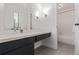 Bathroom featuring double mirrors, a new vanity and a shower over tub at 6455 E Bates Ave # 4-105, Denver, CO 80222
