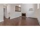 Bright living room with a cozy fireplace, wood floors, and natural light ready for your personal design at 6455 E Bates Ave # 4-105, Denver, CO 80222