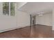 A bright living room with wood flooring, a large window and sliding glass door, ready for personalized touches at 6455 E Bates Ave # 4-105, Denver, CO 80222