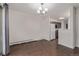 Bright living space flows into kitchen, with wood floors, lots of light and a sliding door to a patio at 6455 E Bates Ave # 4-105, Denver, CO 80222