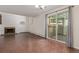 Inviting living room with fireplace, wood flooring, natural light, and access to a private outdoor space at 6455 E Bates Ave # 4-105, Denver, CO 80222