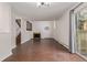 A living room featuring wood flooring, a decorative fireplace, staircase, and a sliding door to the outside at 6455 E Bates Ave # 4-105, Denver, CO 80222