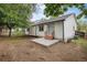 Spacious backyard with a concrete patio and a mix of grass and mulch, perfect for outdoor living at 5214 S Tibet St, Aurora, CO 80015