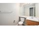 Well-lit bathroom with vanity, toilet, and ample counter space at 5214 S Tibet St, Aurora, CO 80015