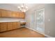 Charming dining area adjacent to the kitchen featuring wood floors and sliding glass door to the backyard at 5214 S Tibet St, Aurora, CO 80015