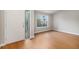 Inviting entryway with hardwood floors, decorative glass door, and a bright window for natural light at 5214 S Tibet St, Aurora, CO 80015