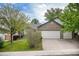 Spacious home with a three-car garage, manicured lawn, and beautiful curb appeal in a desirable location at 5214 S Tibet St, Aurora, CO 80015