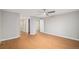 Spacious main bedroom with hardwood floors, ceiling fan and en suite bathroom at 5214 S Tibet St, Aurora, CO 80015