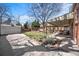 Expansive backyard with patio, pergola, garage, and lovely garden beds at 1615 Kearney St, Denver, CO 80220