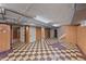 Basement with checkered flooring leading to stairs at 1615 Kearney St, Denver, CO 80220