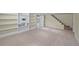 Finished basement with built-in shelving and access to the upstairs at 1615 Kearney St, Denver, CO 80220