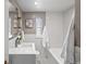 Bright bathroom with white subway tile, updated fixtures, and modern sink at 1615 Kearney St, Denver, CO 80220