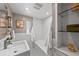 Bright bathroom featuring tub/shower combo, a large sink, and modern decor at 1615 Kearney St, Denver, CO 80220