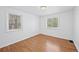 This bedroom is bright and spacious with hardwood floors and two windows at 1615 Kearney St, Denver, CO 80220