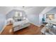 Bedroom with hardwood floors, soft blue paint, and great natural light at 1615 Kearney St, Denver, CO 80220