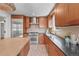 This kitchen features stainless steel appliances, a gas range, and plenty of counter space at 1615 Kearney St, Denver, CO 80220