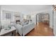 Airy living room features hardwood floors, fireplace and seamlessly connects to the dining area through an elegant arched entryway at 1615 Kearney St, Denver, CO 80220