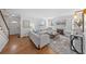 Bright living room boasts hardwood floors, a fireplace, and comfortable seating creating a cozy and inviting atmosphere at 1615 Kearney St, Denver, CO 80220