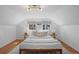 Comfortable main bedroom with a plush rug, bedside tables, and cozy lighting at 1615 Kearney St, Denver, CO 80220