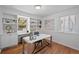 Bright home office features custom built-ins, a modern desk, and ample natural light, creating an ideal workspace at 1615 Kearney St, Denver, CO 80220