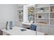 Bright home office features built-in shelving and cabinets with a window at 1615 Kearney St, Denver, CO 80220