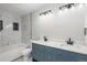 Modern bathroom with dual vanity, marble tile, and bathtub at 4575 Gibraltar St, Denver, CO 80249