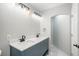 Updated bathroom with dual vanity, quartz countertop, and modern lighting at 4575 Gibraltar St, Denver, CO 80249