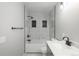 Clean bathroom, featuring a bathtub, marble tile and modern fixtures at 4575 Gibraltar St, Denver, CO 80249