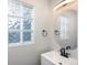 Updated bathroom with a modern vanity and a stylish mirror at 4575 Gibraltar St, Denver, CO 80249