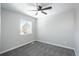 Bright bedroom with a ceiling fan and large window at 4575 Gibraltar St, Denver, CO 80249