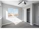 Well-lit bedroom with double closet and ceiling fan at 4575 Gibraltar St, Denver, CO 80249