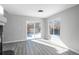 Dining area with gray flooring and sliding glass door to backyard at 4575 Gibraltar St, Denver, CO 80249