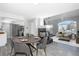 Dining area with a round table and chairs, open to living room at 4575 Gibraltar St, Denver, CO 80249