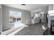 Modern kitchen with white cabinets and gray flooring at 4575 Gibraltar St, Denver, CO 80249