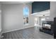 Bright living room with fireplace, gray flooring and large window at 4575 Gibraltar St, Denver, CO 80249