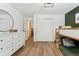 Bright bedroom featuring a closet, dresser, and stylish decor, all enhanced by the natural light at 34103 Forest Park Dr, Elizabeth, CO 80107