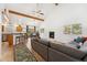 Spacious open-concept living room with hardwood floors, vaulted ceilings and a cozy fireplace at 34103 Forest Park Dr, Elizabeth, CO 80107
