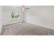 Empty bedroom with neutral carpet, a ceiling fan, and a window at 9575 Garland Ct, Westminster, CO 80021