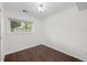 Bedroom with hardwood flooring, natural light from window, and neutral walls for a serene living space at 9575 Garland Ct, Westminster, CO 80021