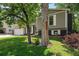 A lovely home with a well-kept lawn, complemented by mature trees and attractive brick accents at 9575 Garland Ct, Westminster, CO 80021
