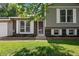 Charming home exterior featuring a brick facade, well-maintained lawn, and beautiful white shutters at 9575 Garland Ct, Westminster, CO 80021