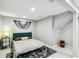 Comfortable bedroom with stylish decor, featuring a queen-sized bed and ample space at 3612 Rosewalk Cir, Highlands Ranch, CO 80129